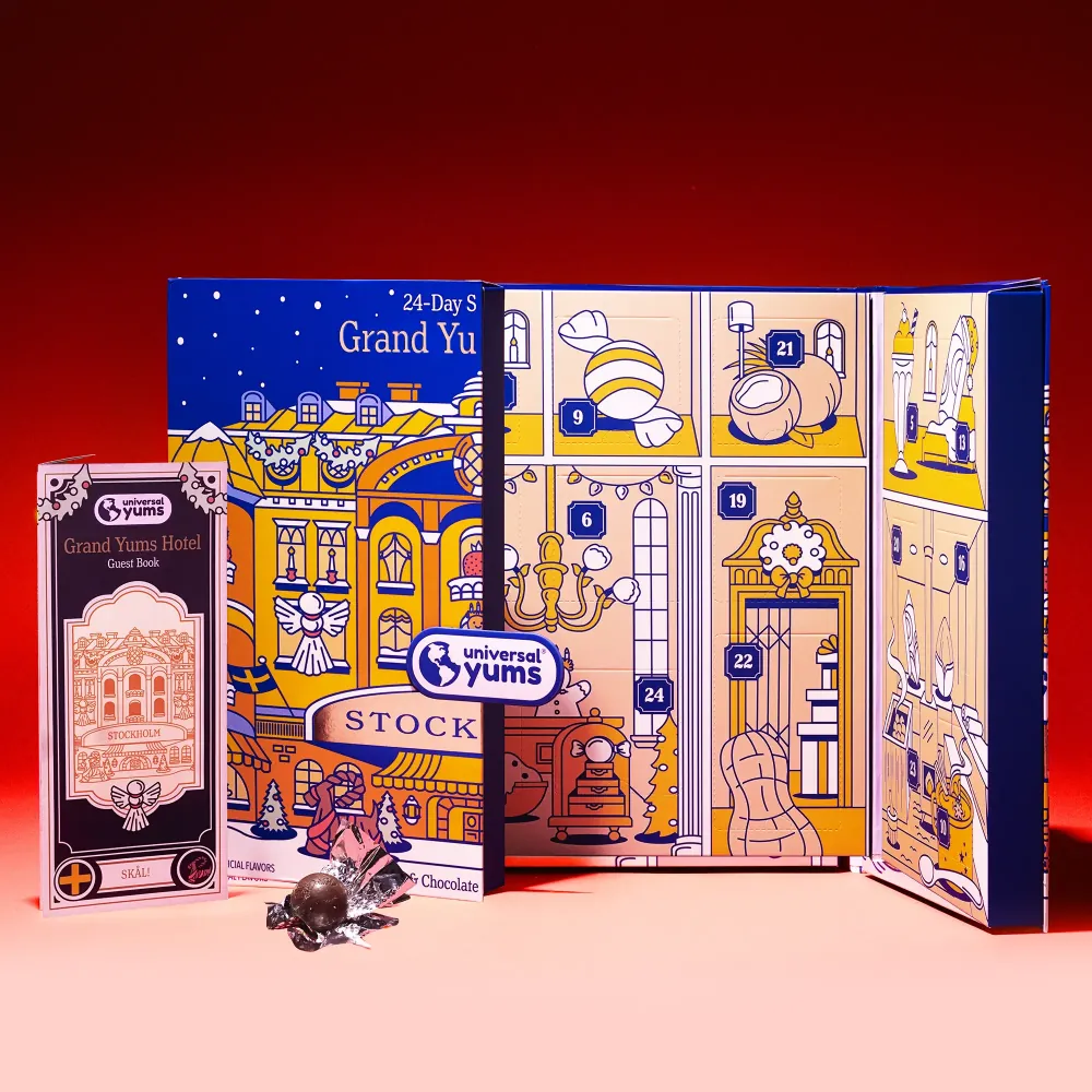 The Grand Yums Hotel Stockholm advent calendar opened to its numbered doors, with its guest book and a Swedish chocolate.