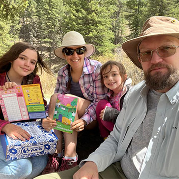 Family holding Universal Yums box.